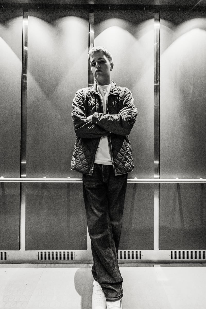 Logan seated on the ground looking up